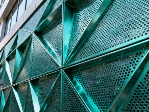 Construction Specialties decorative grille and screen system on building facade